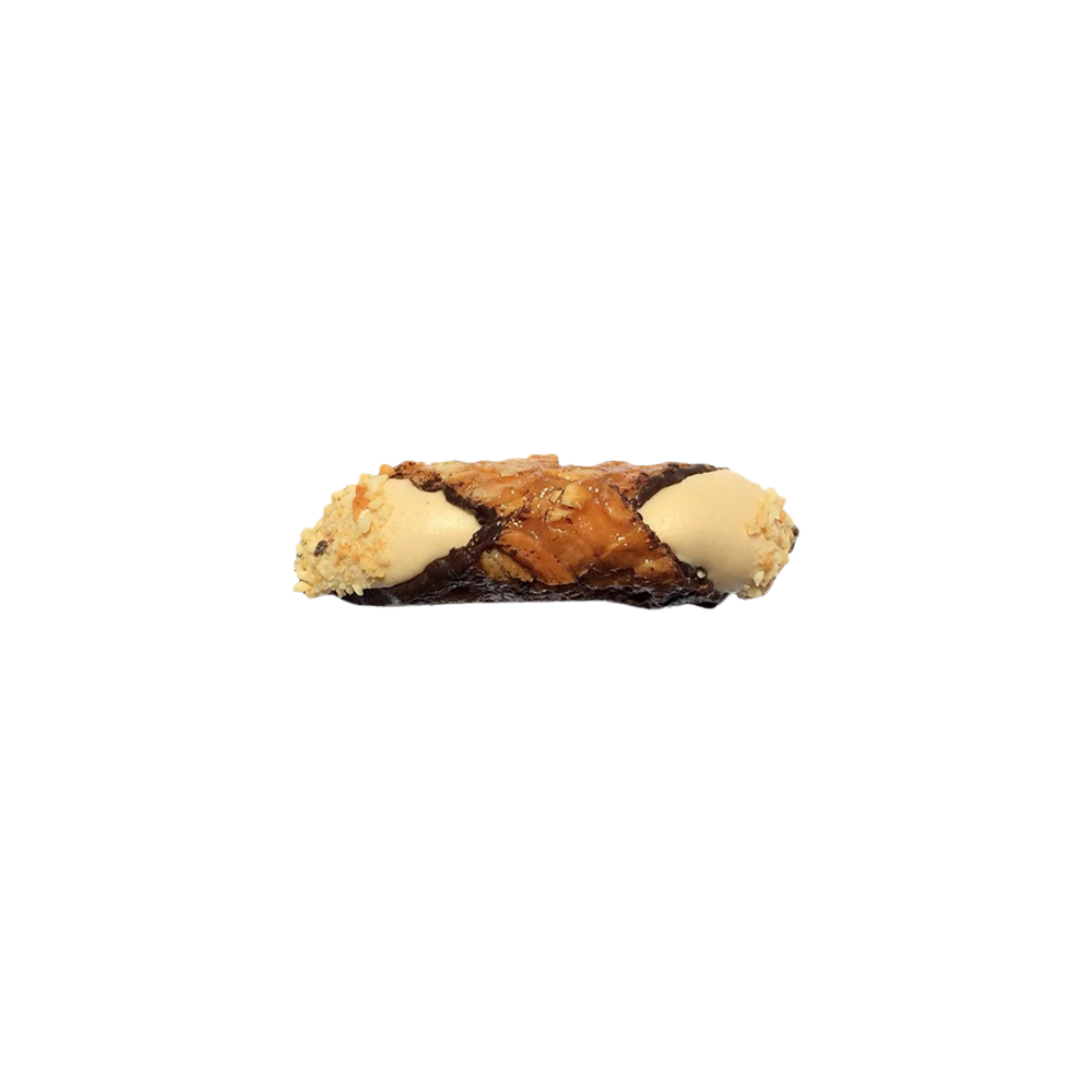 Close up of almond brittle cannoli shell with salted caramel cream filling